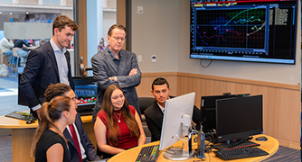 Image of Marist School of Management professor with students