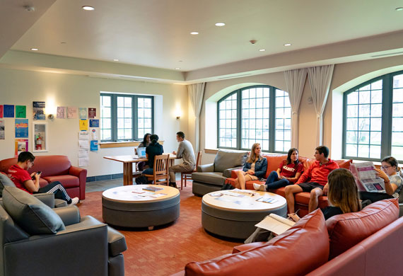 Image of students interacting in lounge.
