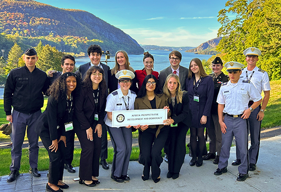 Image of Marist political science student Suzie Kolmel ’26 with her group from the SCUSA conference on West Point’s campus.