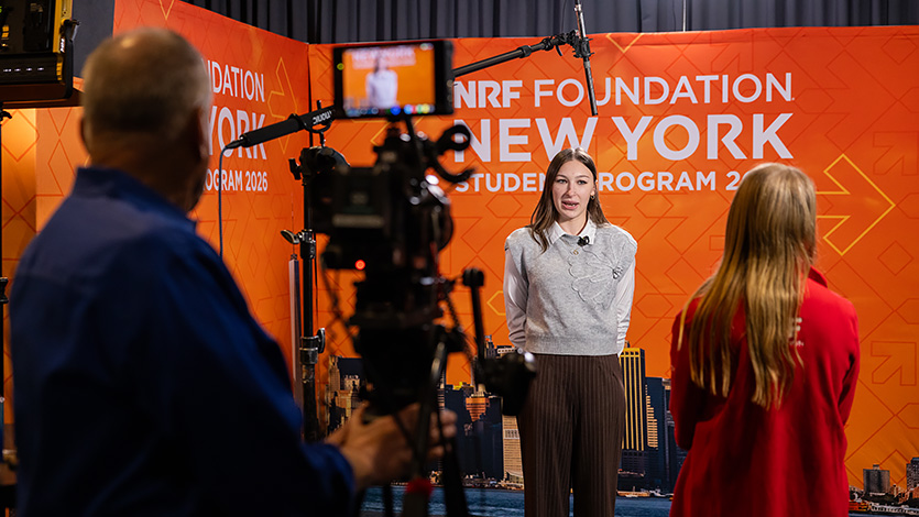 Marist University image: Elsie Mele '26 speaks to media at the NRF Foundation event in New York City.