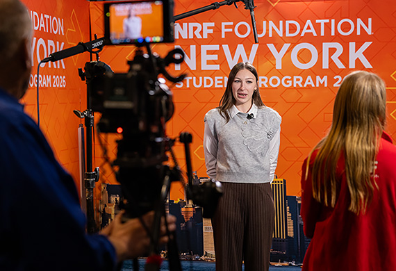 Marist University image: Elsie Mele '26 speaks to media at the NRF Foundation event in New York City.