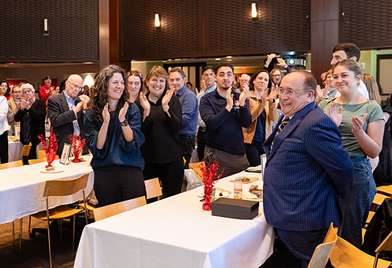 From left: Controller Christina Kearney, Dr. Byunghoon Jin, and Dr. John Cary stand for recognition of their 10 years of service during the April 27 Milestone and Farewell Reception event in The Cabaret.