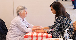 image of two people sitting across from one another