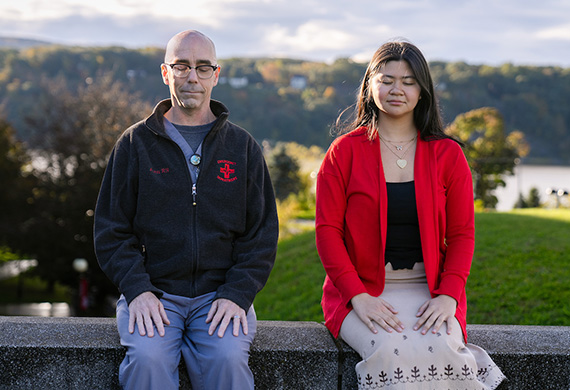 Image of Marist's Monk with student meditating