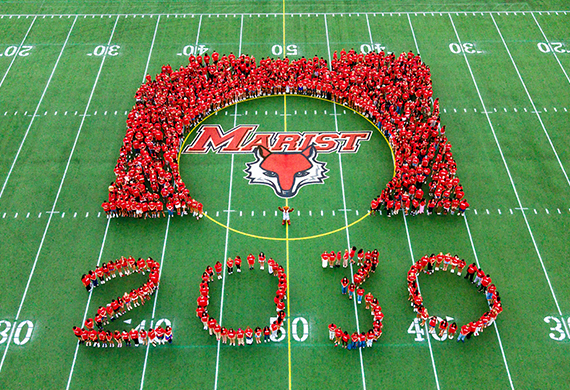 Image of the class of 2030 on the football field in the