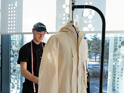 Photo of student working with mannequin