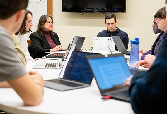 image of Marist students with their computers in class