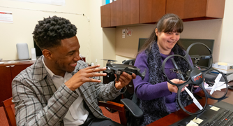 Image of students working in the Internet of Things Lab.