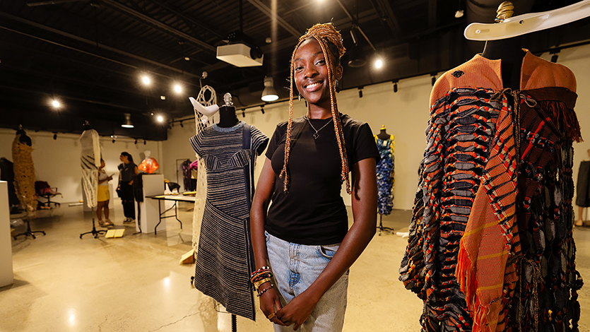 Kunda Nampasa ’25 preparing for the exhibit at Steel Plant. Photo by Nelson Echeverria/Marist College.