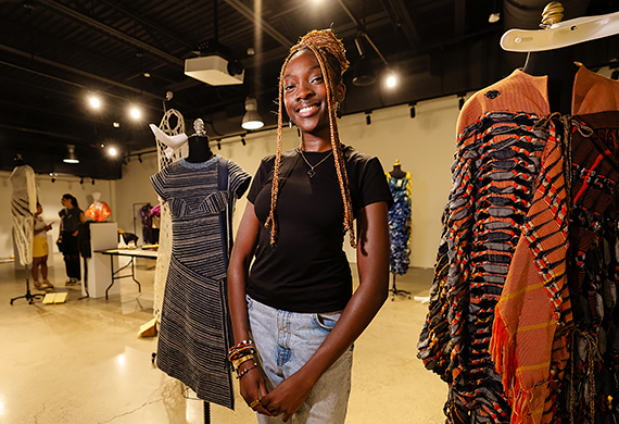 Kunda Nampasa ’25 preparing for the exhibit at Steel Plant. Photo by Nelson Echeverria/Marist College.