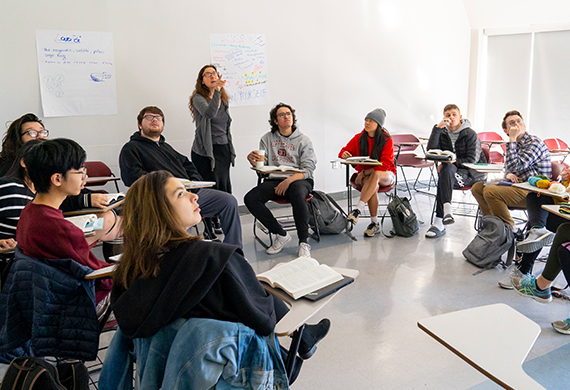 Image of students and professor in class.