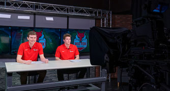 Image of students producing a television show in the TV studio.