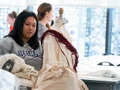 Photo of student working with textiles