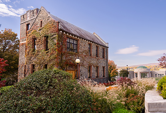 Image of Greystone with Student Center Rotunda in background.