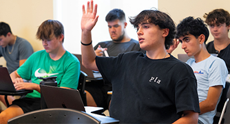 image of student raising his hand