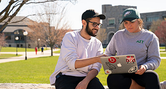 Image of students sitting on campus