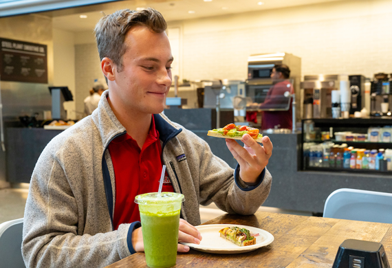 Image of student eating avocado toast in Steel Plant.