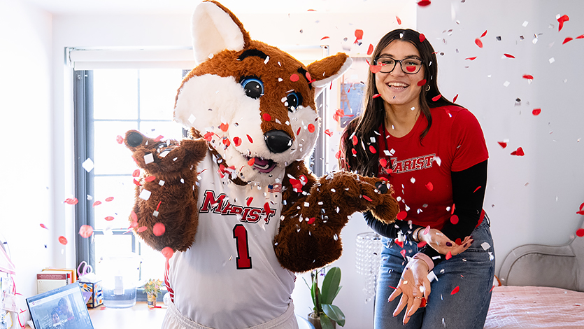 Image of student with Frankie the Fox.