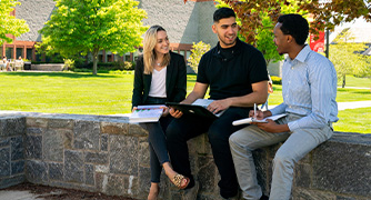 Image of students sitting on wall