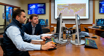 Image of two students in the investment center