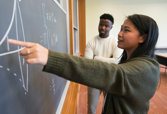 Image of students collaborating in a classrom.