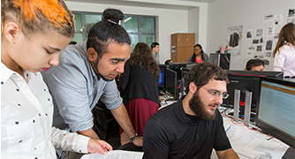 Image of students collaborating at a computer