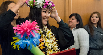 Image of Hawaiian student being celebrated at graduation