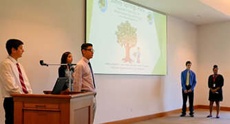 An image of students giving a presentation 