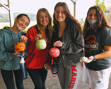 Image of the Red Ink club with painted pumpkins.