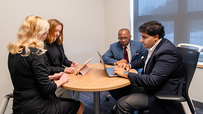 Image of students and career coaches sitting at a table in the Center for Career Servies.