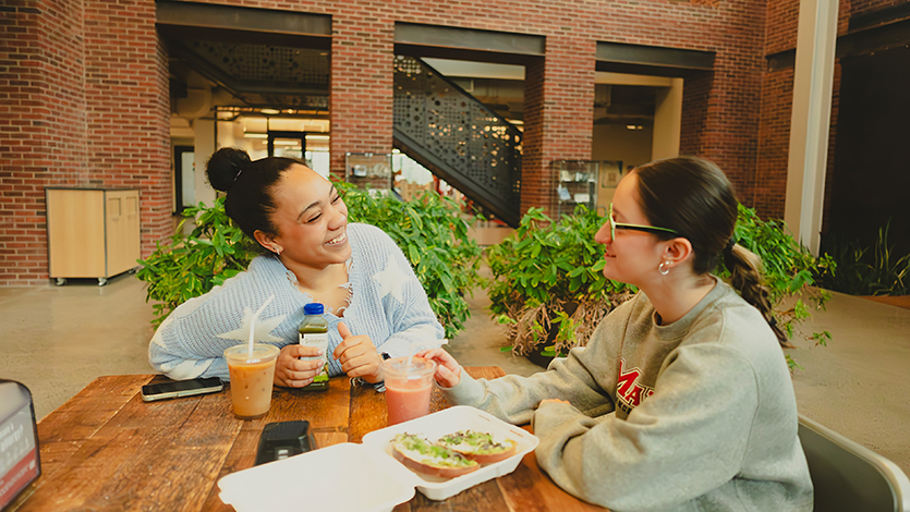 Image of Jadyn and Lauren talking at Steel Plant Cafe.