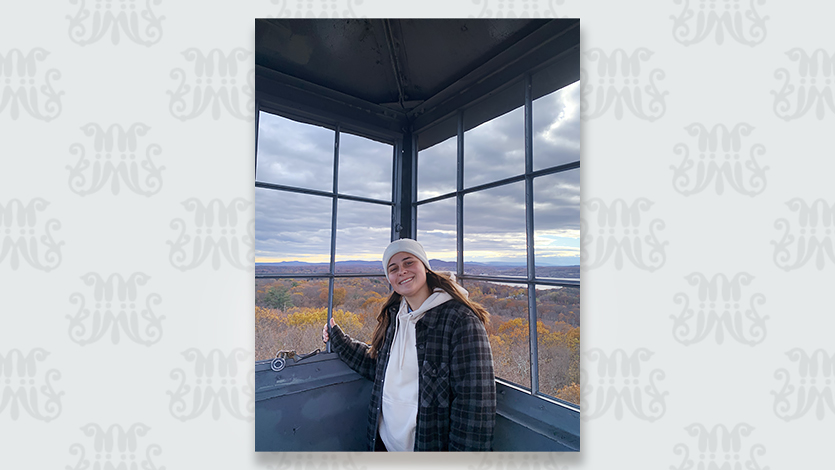 Image of Haley Merrill '24 on top of the Ferncliff Tower