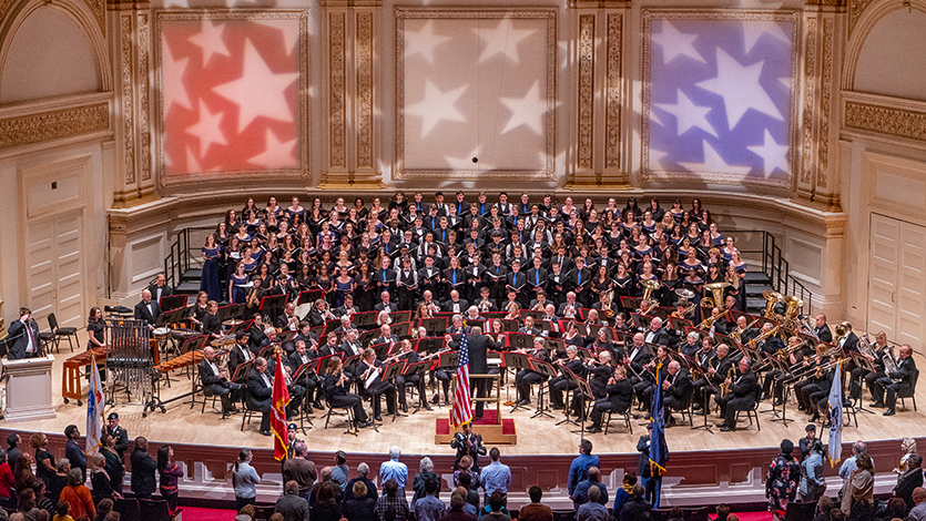Image of Art Himmelberger conducting Marist band and singers at Carnegie Hall in 2019.