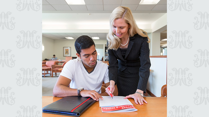 Image of Dr. Mary O. Jones working with a student on career planning.