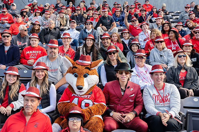 Image of Sean Stellato and Frankie at the football game.