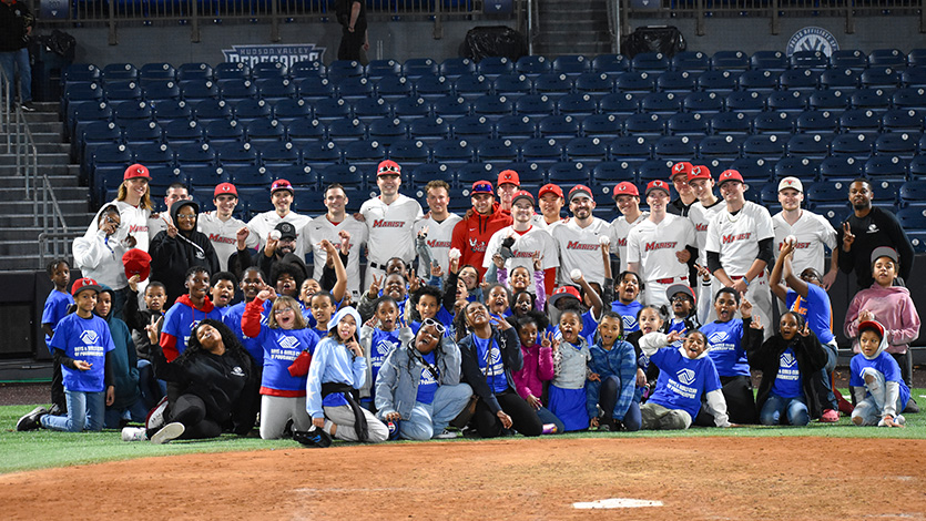 Image of baseball team with members of the Boys & Girls club.