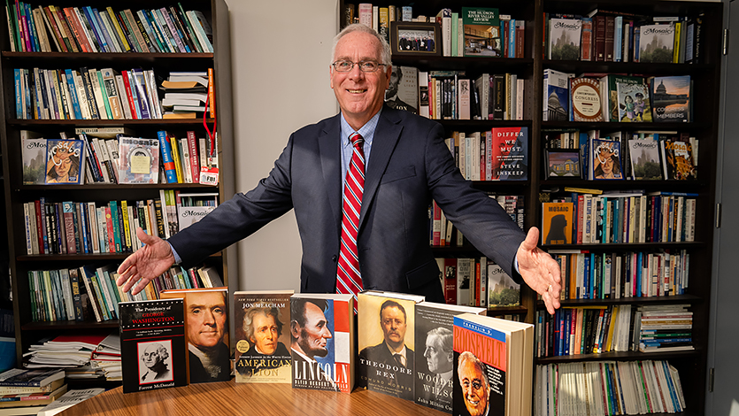 Dean Shaffer with his impressive collection of presidential biographies.