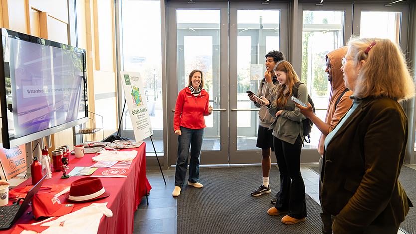 SAPC member Beth Veasey (left) and students during the Green Games, testing their knowledge of sustainable practices.