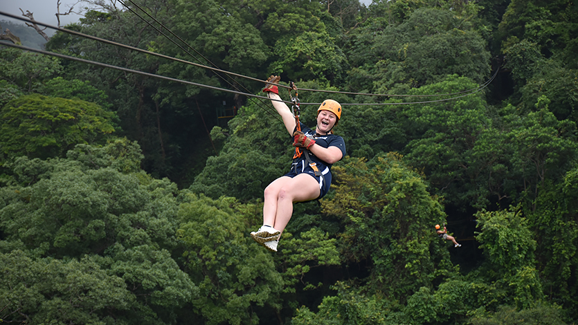 Image of Jenna Jedlicka on a zip line during the recreational day of the Costa Rica trip.