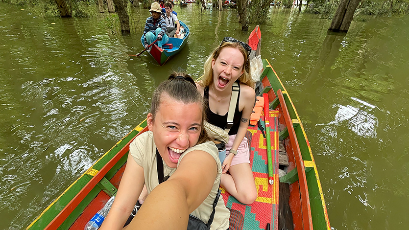 Image of Veronica Vogelman '26 and Elizabeth Granholm '25 touring the Floating Village Kamplong Pluk, Cambodia.