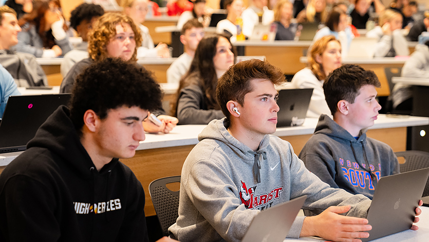 Image of students watching the documentary at the screening in the Dyson Center.