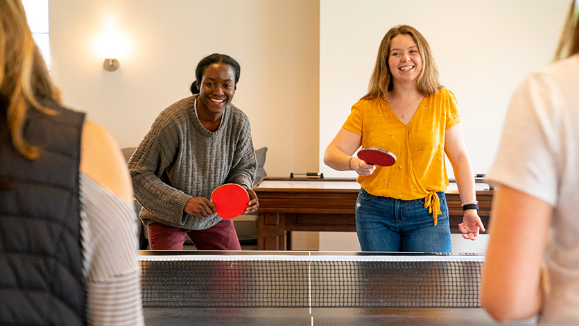 Image of students playing ping pong.