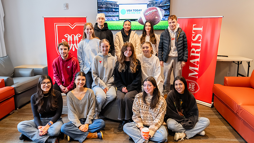 Image of Marist students gathered in Ward Hall to watch and rate Super Bowl Ads.