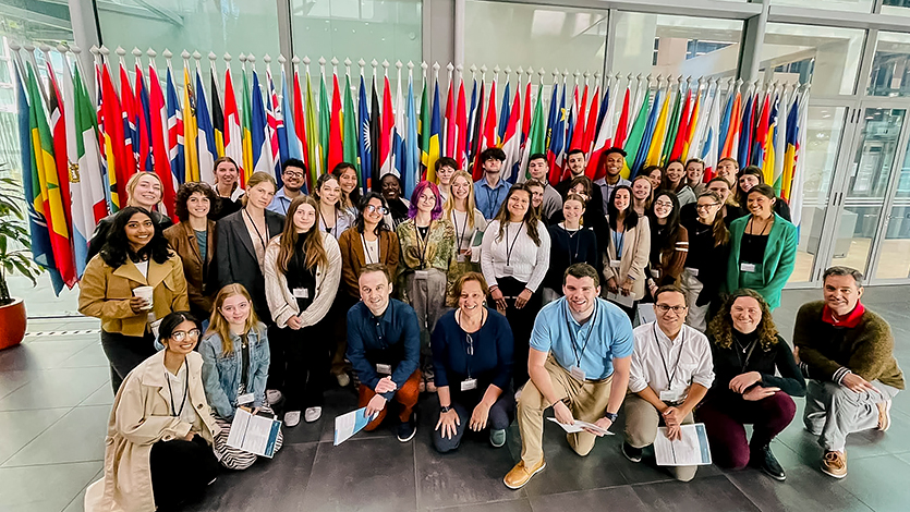 Image of 2023 attachment course students studying crime, justice, and international law in the Netherlands pose for a photo. 