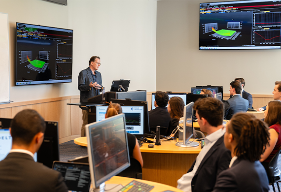 Photo of students and faculty in the Investment Center