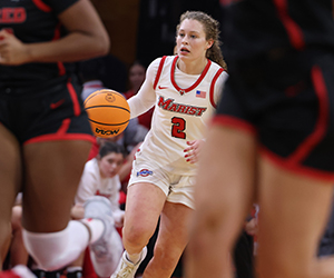 Image of Jackie Piddock playing basketball.