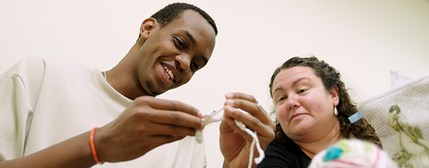 Image of Loik Makuza crocheting.