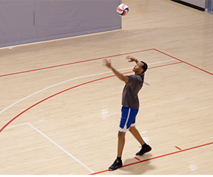 Image of Loik Makuza playing volleyball.