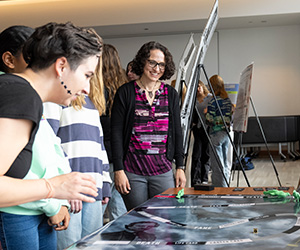 Image of Patty Tarantello at a student presentation.