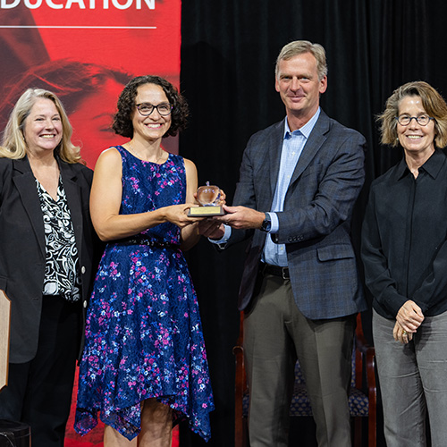 Image of Patty Tarantello receiving the Board of Trustees Faculty Award for Distinguished Teaching.